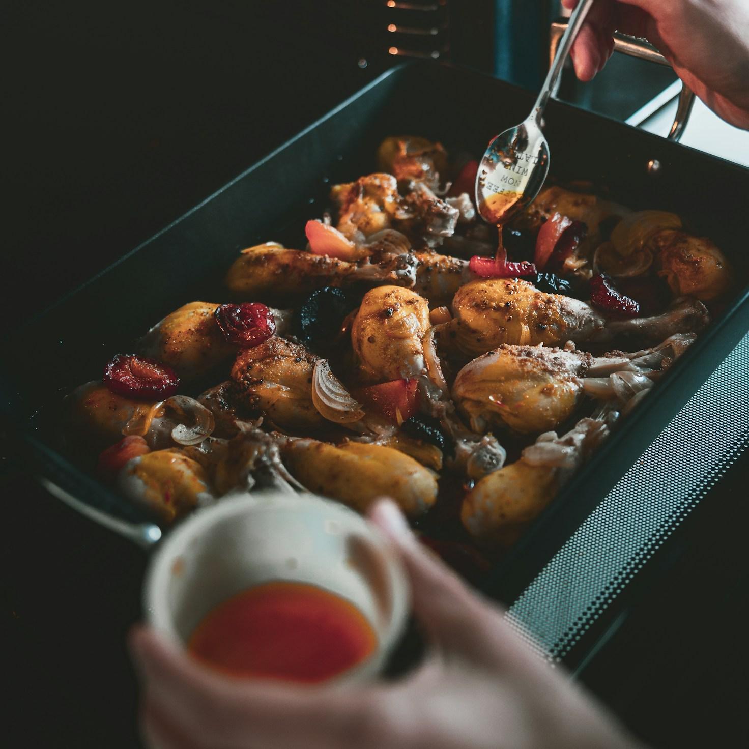 Diverse group of community members sharing a meal together, showcasing the social bonds formed through collaborative cooking